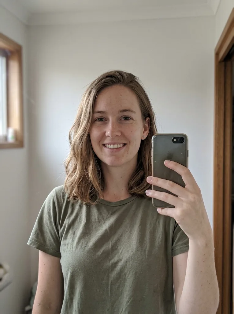 A casual indoor selfie of an Australian woman before the edit